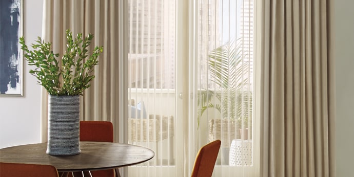 Drapery and vertical blinds layering on patio door