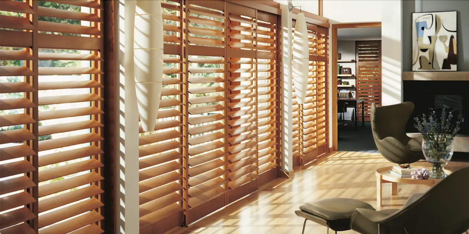 Floor to ceiling windows with hardwood shutters in a warm colour for fall